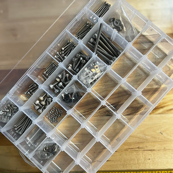 Stainless steel Zero G Mercury One.1 fastener kit with screws, washers, nuts and inserts in a compartment box