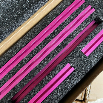 Pink anodized MakerBeam XL 15x15 extrusions packed in foam for Pandora's Box frame kit