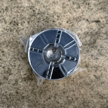 Sealed spool of black Decent ASA-CF carbon-fiber reinforced 3D printer filament