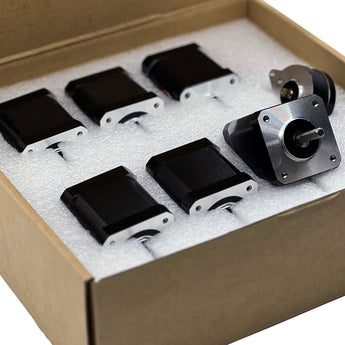 DFH Voron V2 motor kit with seven black stepper motors packed in a foam-lined cardboard box