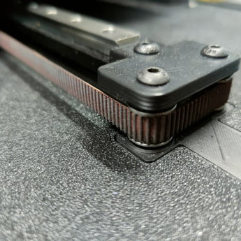 Close-up of the Voron Switchwire 9mm Y-axis belt mod showing the wider GT2 belt running around stacked idler bearings.