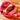 Red plush rabbit hat with long floppy ears, paw-shaped flaps, embroidered face, and white inner ear lining