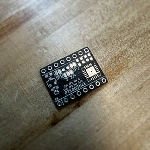 Black Voron PT100Stick bare PCB blank with StepStick header pads and MAX31865 footprint