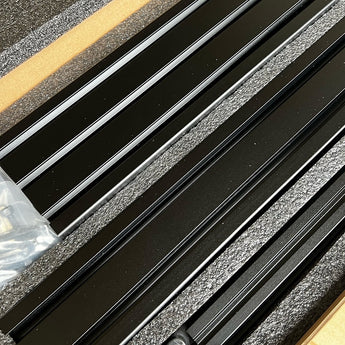 Black LH Stinger structural kit aluminum extrusions with hardware in foam packaging
