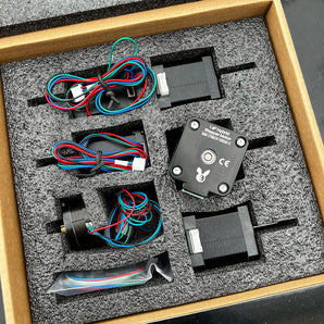 Pandora's Box stepper motor kit with NEMA17 Z motors, NEMA14 XY motors, geared extruder motor, and wiring in foam packaging