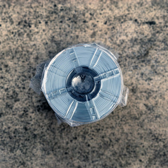 Grey Decent ASA-GF glass-fiber reinforced ASA filament spool sealed in plastic