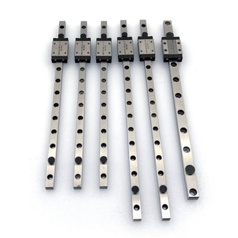 Six DFH 440C stainless MGN linear rails with carriages for Salad Fork 160mm laid out on a white background