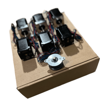 Micron LDO motors kit with seven stepper motors arranged on a cardboard box