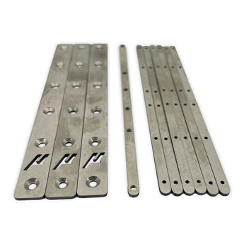 Micron 120 titanium gantry backers and threaded nut bars laid out on white background