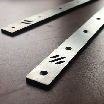 Lightweight Labware titanium extrusion backers with countersunk mounting holes for Voron V2.4 and Trident gantry rails